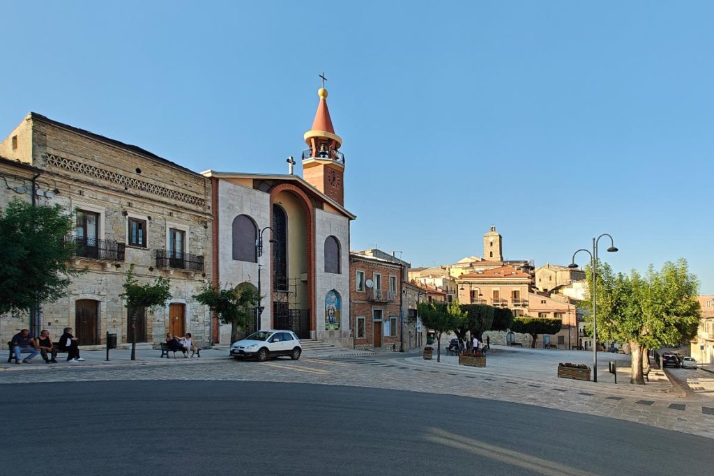 Piazza della Libertà and chiesa della Madonna del Pozzo in Motta Montecorvino, Italy